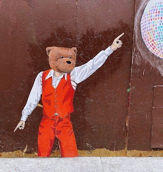 street art of a bear wearing a 3 piece suit