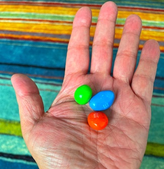 a handful of M&M candy
