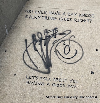 sidewalk graffiti about being positive and having a good day