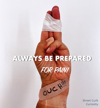 bandaged hand to promote a podcast about pain on Street Curb Curiosity