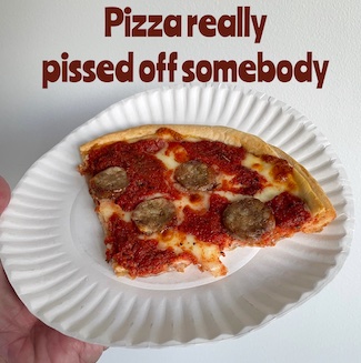 slice of pizza on a paper plate