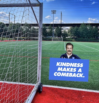 soccer field with ted lasso and kindness