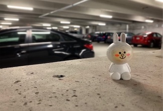 happy bunny toy in a parking garage