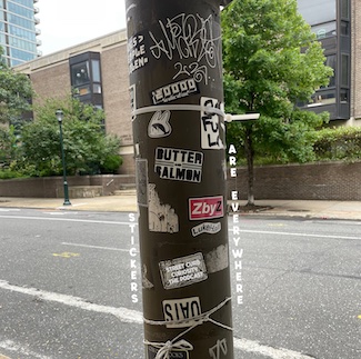 street pole covered with stickers in Philadelphia