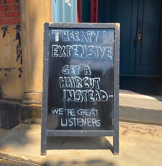 hair salon sign on the streets  in Philly