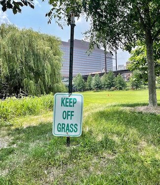 keep off grass sign too low to the ground