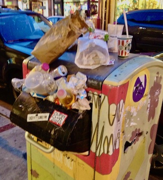 overflowing trash can on South Street, Philadelphia 