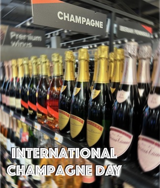 international champagne day in October; bottles of champagne on shelf
