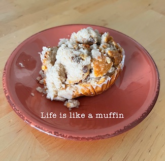 a crushed muffin on a plate to explain the meaning of life.