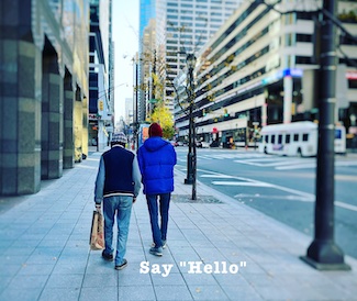 two men walking down city street