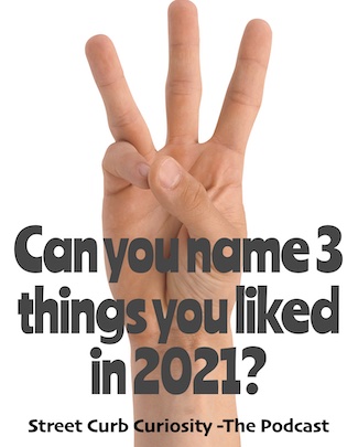 three fingers to show how many things you liked in 2021, to promote podcast Street Curb Curiosity