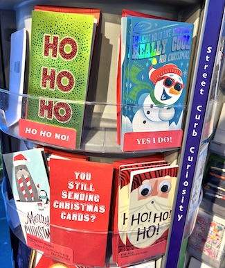 Christmas card display to promote podcast street curb curiosity
