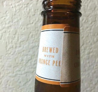 misaligned label on bottle sending the wrong message to consumers