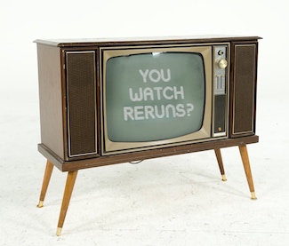 an old style TV cabinet with a question: You watch reruns?