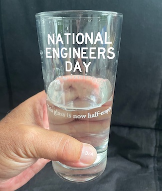 a half-full glass of water to celebrate National Engineers day in march for Blog www.Caremoretoday.com