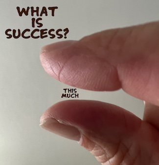 how big is a big success; image of two fingers showing small amount