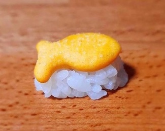 an unusual piece of sushi created with a goldfish cracker for an idea about bad products in today's blog