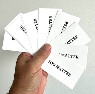 Handful of business cards that say you matter for the daily blog from www.caremoretoday.com