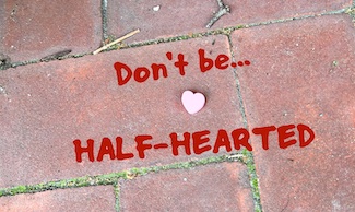 candy heart on the sidewalk to highlight a motivational blog about heart disease