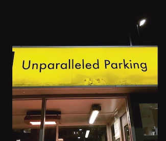 a sign outside a city parking garage with a wonderful name.