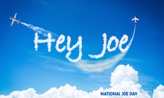 two airplanes skywriting the words "Hey Joe"