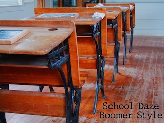 A row of old school student desks in a classroom from back in the 1960's