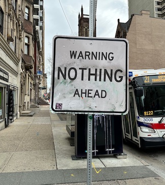 a city street sign warning that nothing is ahead