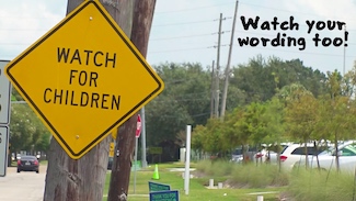 a street sign that says watch for children