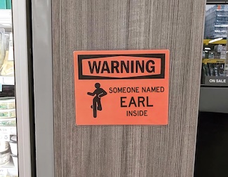a funny sign warning people about a guy named Earl in a random store