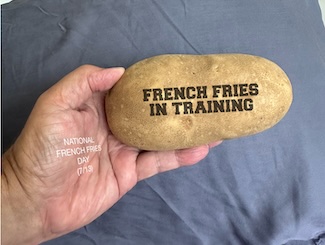 a potato ready to be French fries for national French fries day in July