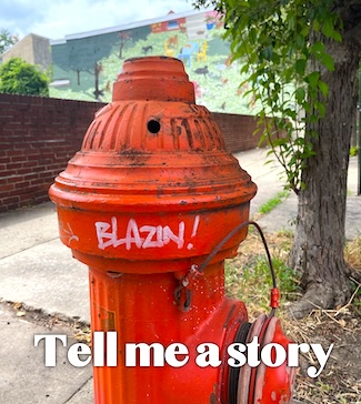 a red fire hydrant with the word blazin painted on it