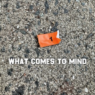 a torn orange label with a black number one found on a city sidewalk. for a curiosity question from the daily blog www.caremoretoday.com