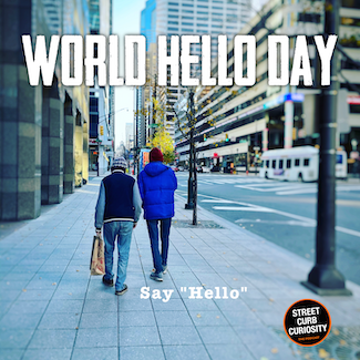two people walking on a city street for world hello day in November, and for a podcast about saying hello to strangers