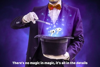 a magician in a purple suit contouring a pair of AirPods to of a hat with a magic wand to highlight the anniversary of the Apple AirPods, released this week in 2016.