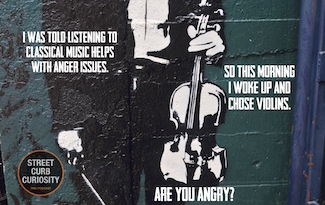 a funny bit of graffiti about violins and being angry, as a podcast topic for being angry.