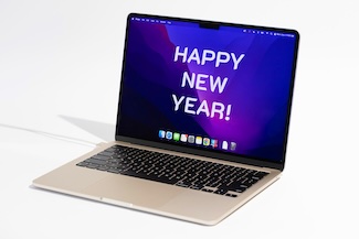 a MacBook laptop to show off it's 2024 resolution, a perfect geek dad joke for the new year