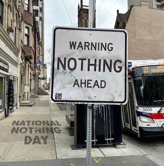 a funny street sign warning that there is nothing ahead on a city street for national nothing day in January 