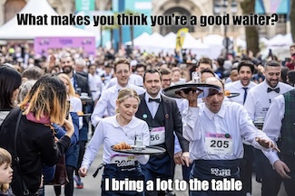 A photo of some smiling waiters in the 2014 Paris Waiter olympics on the city streets of Paris France
