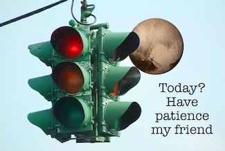 a green traffic light showing red to stop, and the planet Pluto 