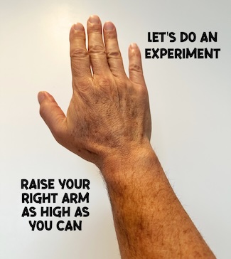 a raised right hand and arm for an experiment on what you can really do
