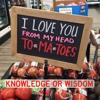 a display of tomatoes in a grocery store with a fun sign about love
