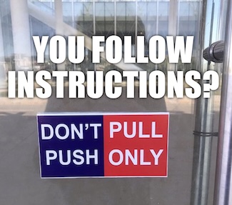 a confusing sign on how to get through a door