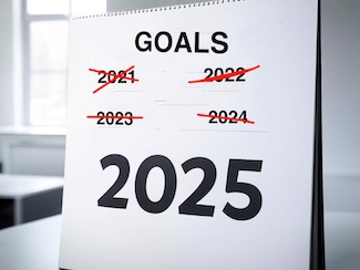 A calendar on a table with the last 4 years crossed off, highlighting 2025 for a thought about goals
