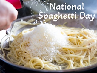 a plate full of spaghetti that is being covered with grated cheese for a motivational moment on national spaghetti day
