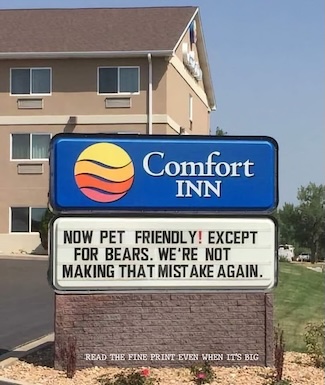 a fun sign outside of a hotel about the establishment being pet friendly, except for bears