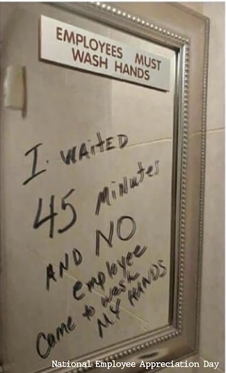 a fun message about washing your hands written on a bathroom mirror at some business