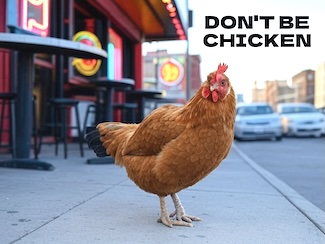 a chicken standing outside a bar after crossing a city road