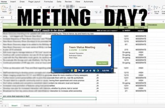 a screen shot of a computer screen with work on a spreadsheet with a pop up meeting reminder 