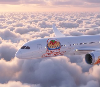 a passenger jet with a spaghetti logo flying high in the sky for national spaghetti day in January