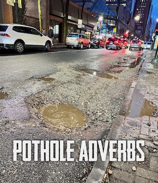 a rain soaked bunch of potholes on chestnut street in downtown Philadelphia 